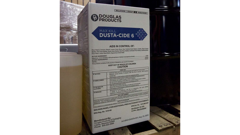 Box of Douglas Products DUST-A-CIDE 6 on a wooden pallet with a white background