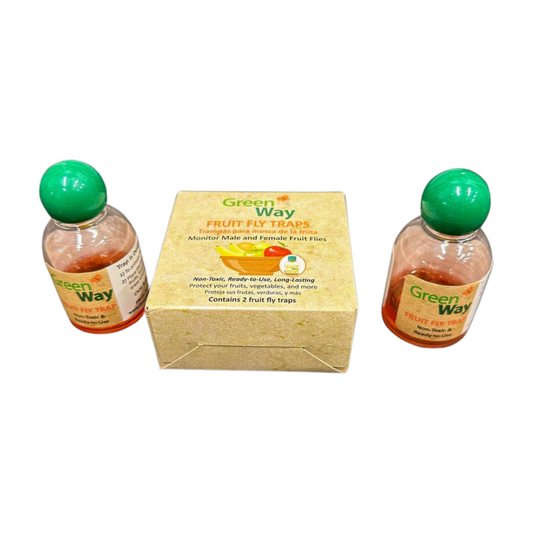 Two bottles of Fruit Fly Traps with green lids, next to their packaging box which has 'Green Way' branding and an image of a fruit fly on it.