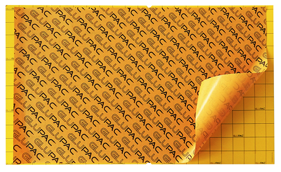 A stack of yellow glueboards with the branding 'PAC' printed on each one.