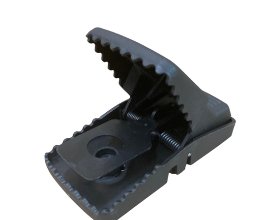 Black plastic T-Rex rat snap trap with interlocking teeth and a removable bait cup.